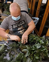 Man making wreath